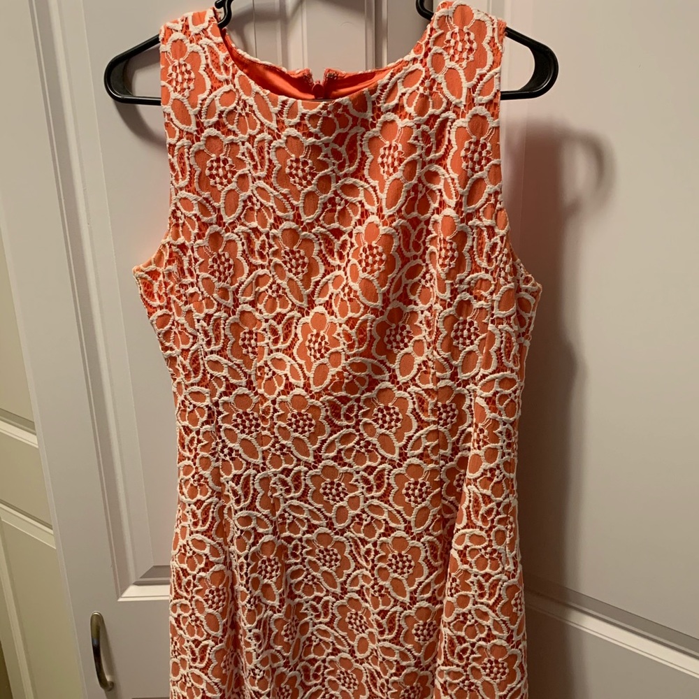 Knee length coral dress with crochet overlay